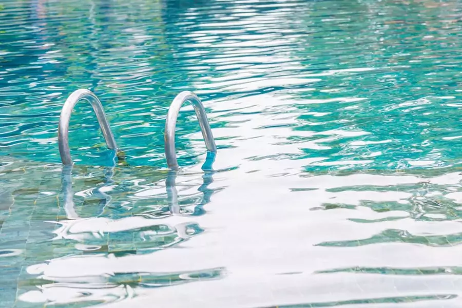 Swimming pool algae treatment